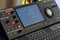Modern digital mixing console with faders, control buttons and screen
