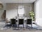 Modern dining room with blue furniture and a dining table with spotted carpet near the window