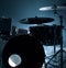 Modern drum set shot in smoky dark studio