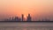 Modern Dubai skyline reflects on waterfront at dusk, illuminated yellow generated by AI