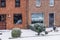 Modern dutch terraced houses with a garden during a cold winter day, snowy weather in a small village of the Netherlands