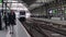 Modern dutch train arriving at platform inside railway station showing Rotterdam