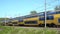 Modern dutch train passing in full speed