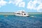 Modern Egyptian Diving Boat In The Sea Near Coral Reef Island. White Marine Pleasure Craft With Tourists In The Red Sea.