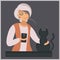 A modern elderly lady with a gadget stroking a black cat in the evening. Grandma and pet. Elegant woman with a cat