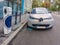 Modern electric car EV Car plugged in charging on the street station. New energy vehicles, eco-friendly alternative energy for