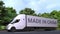 Modern electric semi-trailer truck with MADE IN CHINA text on the side. Chinese import or export related 3D rendering