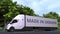 Modern electric semi-trailer truck with MADE IN UKRAINE text on the side. Ukrainian import or export related loopable 3D