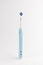 Modern electric toothbrush stands isolated