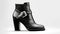 Modern elegance: Shiny black leather high heels, a fashionable pair generated by AI