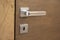 Modern and elegant door handle on wooden door