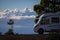 Modern elegant motorhome cozy home parked off road with blue sky and clouds in background. Concept of freedom and travel lifestyle