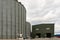 Modern elevator for storing grain against the sky. Grain drying complex, storage and transportation of grain. Large granary in the