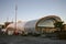 Modern elliptical glazing glass facade and twisting fabric roof of Cloud at sunrise on Queens Wharf, Auckland, New Zealand