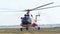 Modern emergency medicine helicopter take off at airfield