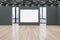 Modern empty concrete exhibition hall interior with wooden flooring, blank white poster, windows and city view, many doors and