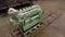 Modern engine on wooden pallet on floor in dry dock