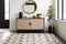 modern entryway with geometric patterned rug and a console table