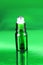 Modern Essential Health Oil bottle on a green background