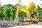 Modern excavator performs excavation work on the construction site