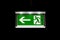 Modern Exit Sign Glass White Illuminated on Black Background Int