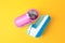 Modern fabric shavers on yellow background, flat lay