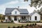 modern farmhouse exterior with fresh paint, sleek metal roof and wrap around porch