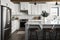 modern farmhouse kitchen with sleek, white cabinets and gray granite countertops