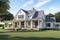 modern farmhouse, with wrap-around porch and swing, overlooking peaceful country landscape