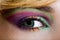 Modern fashion green violet makeup of a female eye