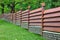 Modern Fence Made From Metal Siding Like As Natural Wood