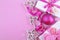 Modern festive pink theme Christmas holiday background with deco