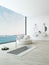 Modern floor bathtub against huge window with seascape view