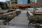 Modern foot bridge to North Kumutoto Pavilion with strips on folded plates on coastal decked square in Wellington CBD, New Zealand