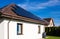 Modern full black solar panels on the roof of a private house