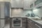 Modern furnished kitchen fridge sink and cabinets