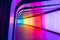 Modern futuristic open-road tunnel illuminated with colorful lights