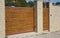 Modern garage door or house fence entrance gate on the street side