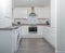 Modern Generic New Build Kitchen in High Gloss White and Grey Laminate Link Flooring
