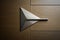 a modern, geometrically-shaped door handle on a sleek metal door