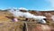 Modern geothermal energy power plant working, Located in a picturesque volcanic landscape in Iceland.