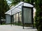 Modern glass bus shelter with polka dots on aluminum frame
