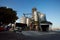 Modern grain terminal on sunset. Metal tanks of elevator. Grain-drying complex construction. Commercial grain or seed