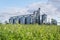 Modern Granary elevator and seed cleaning line. Silver silos on agro-processing and manufacturing plant for storage and processing