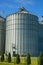 Modern granary. A large agro-processing plant for the storage and processing of grain crops. Vertical image