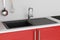 Modern Granite Kitchen Sink with Stainless Steel Water Tap, Faucet Build In Red Kitchen Furniture. 3d Rendering
