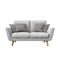 Modern grey fabric and velour sofa with soft pillows on the white background