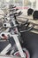 Modern gym interior with equipment, fitness exercise bikes handlebars