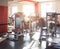 Modern gym for sports and strength training, muscle building, sunset, bodybuilding