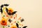 Modern Halloween background with pumpkins, candy, bats, decorations with copy space for text. Isolated on pastel beige background